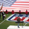 Standing in front of an electronic keyboard set up on the football field, singer Charlie Puth plays the national anthem before this year's Super Bowl on February 8.