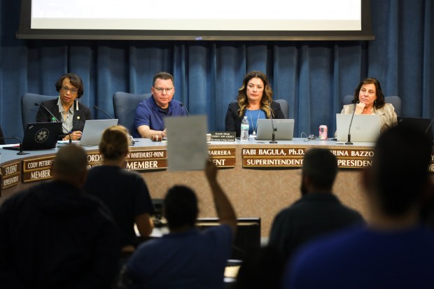San Diego Unified Superintendent Fabiola Bagula, second from right, and board members Sharon Whitehurst-Payne, Richard Barrera and Sabrina Bazzo listen to people speak out against a proposed layoff at the San Diego Unified School District headquarters on Tuesday, March 3, 2026. (Kristian Carreon / The San Diego Union-Tribune)